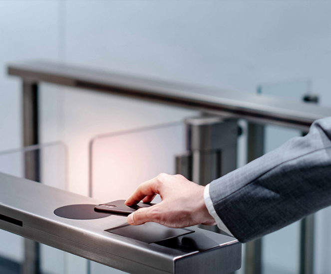 Person tapping phone on a terminal
