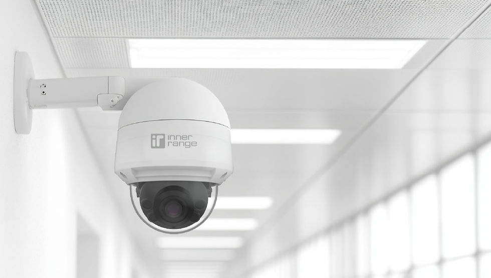Inner Range dome security camera in a distribution center hallway.