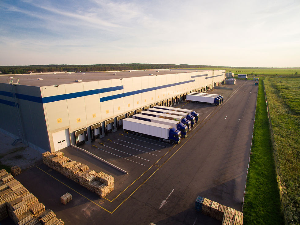 Aerial view of semi-trucks at a distribution center