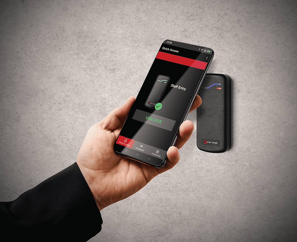 Smartphone unlocking a secure door reader for staff entry.